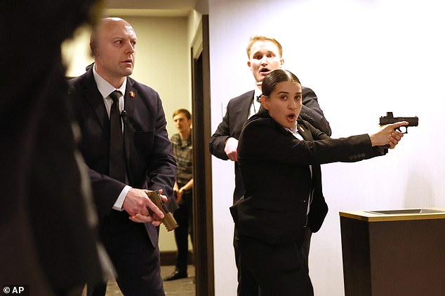 One Secret Service agent was hit at 'point-blank range' with a shotgun blast before returning fire at the suspected gunman, Curran said