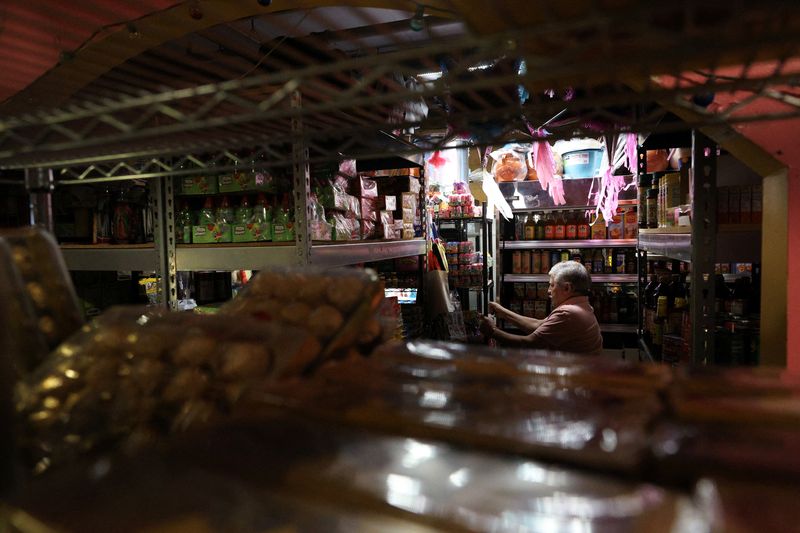 FILE PHOTO: A person works at a grocery store inside Mercado Central, a marketplace of about 35 Latino‑owned small businesses in Minneapolis, Minnesota, U.S., February 12, 2026. REUTERS/Go Nakamura/File Photo