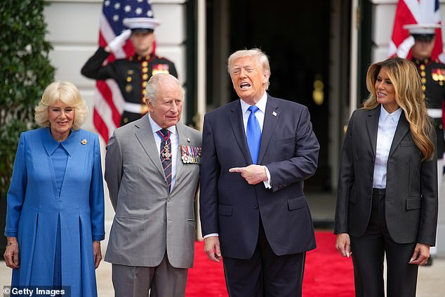 President Donald Trump (center right) points at King Charles and Queen Camilla (left) at an official departure ceremony at the White House Thursday morning, alongside First Lady Melania Trump (right) 
