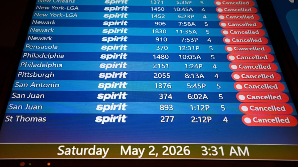 A departure board displays canceled Spirit Airlines flights at Orlando International Airport, as the airline announced it was ceasing operations early Saturday morning. - Miguel Rodriguez/Reuters
