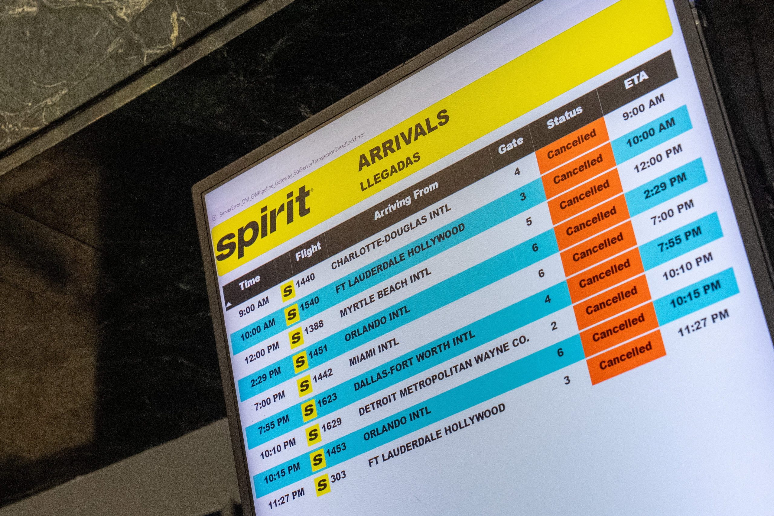 A departure board displays canceled flights, informing passengers of Spirit Airlines' shutdown at LaGuardia Airport in New York City, on May 2, 2026.