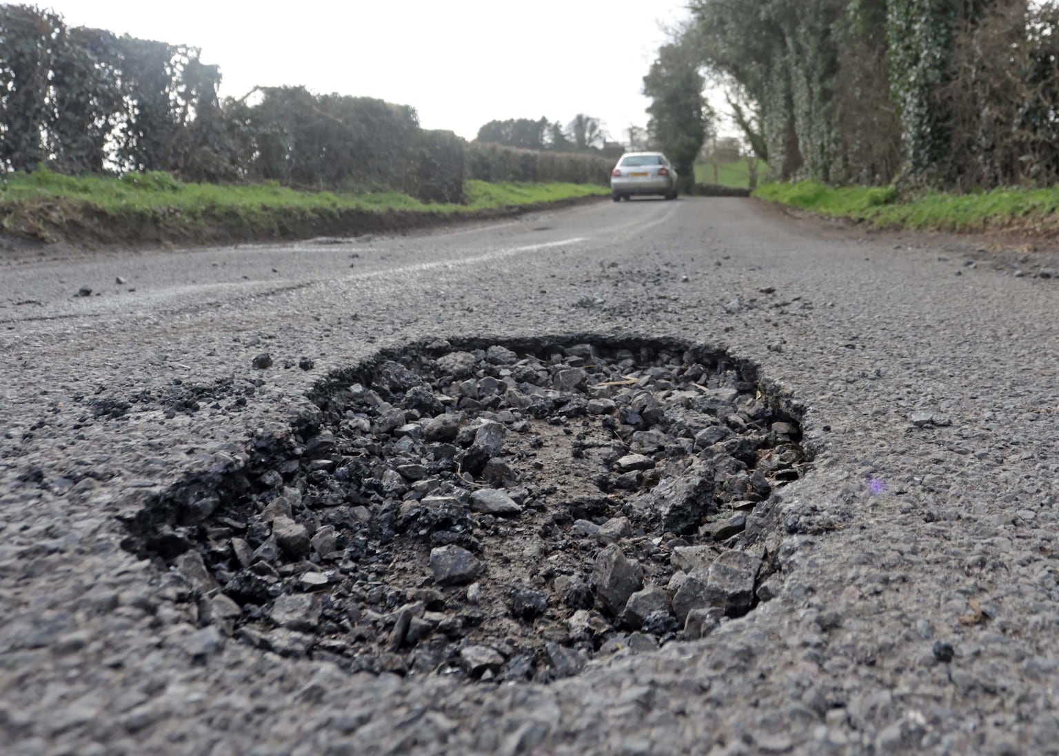 Potholes on the Drennan Road off the Old Ballynahinch Road near Lisburn. PICTURE: COLM LENAGHAN