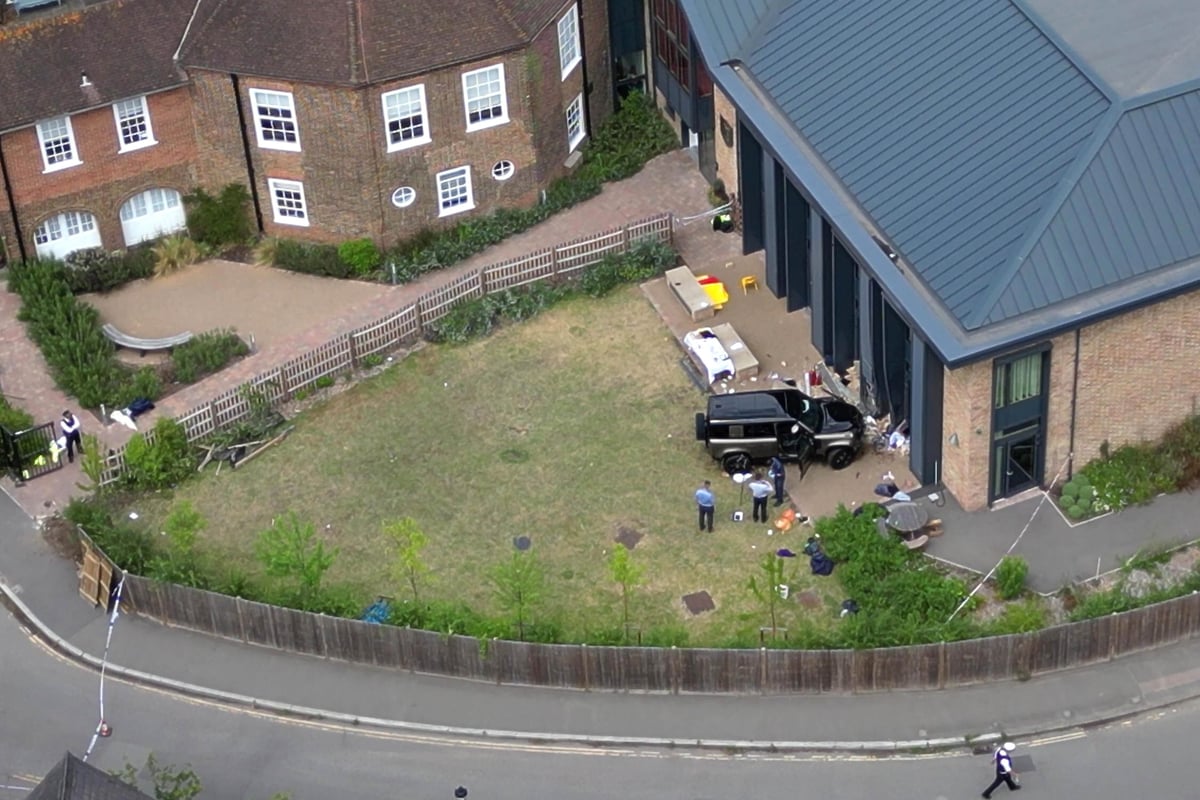 Car collides with primary school building