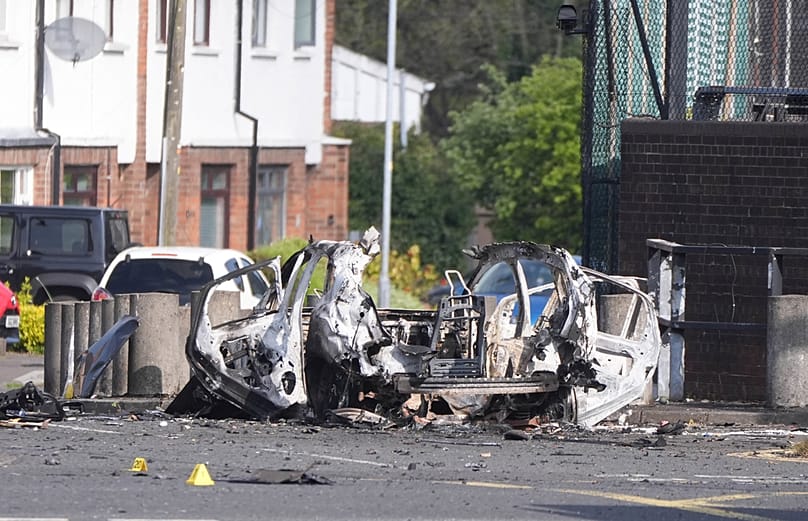 The scene in Dunmurry in Northern Ireland after reports of a car explosion outside a police station, Sunday April 26, 2026. (Niall Carson/PA via AP) Niall Carson/AP