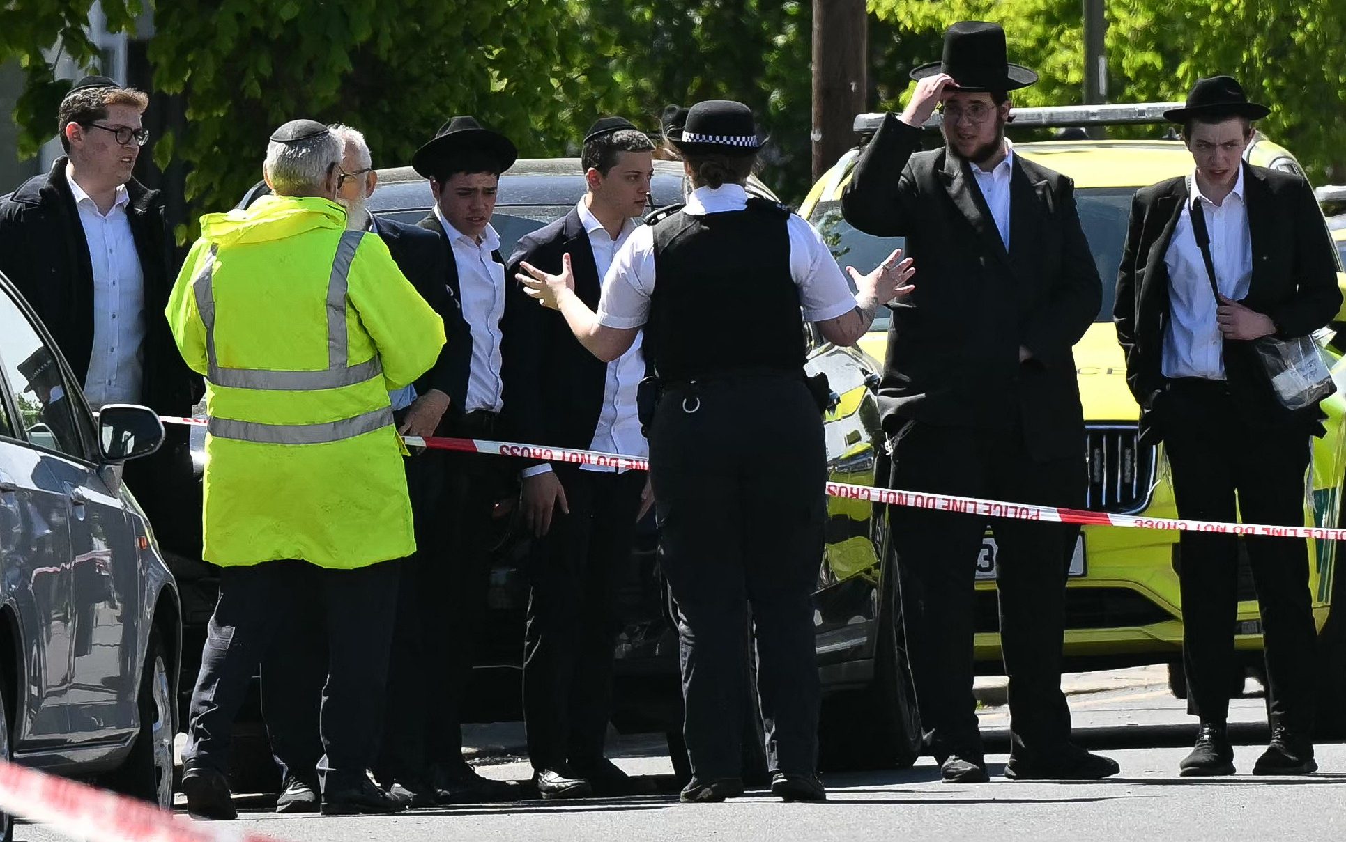 Golders Green residents at the scene of the stabbings in the north London neighbourhood on Wednesday - Justin Tallis/AFP