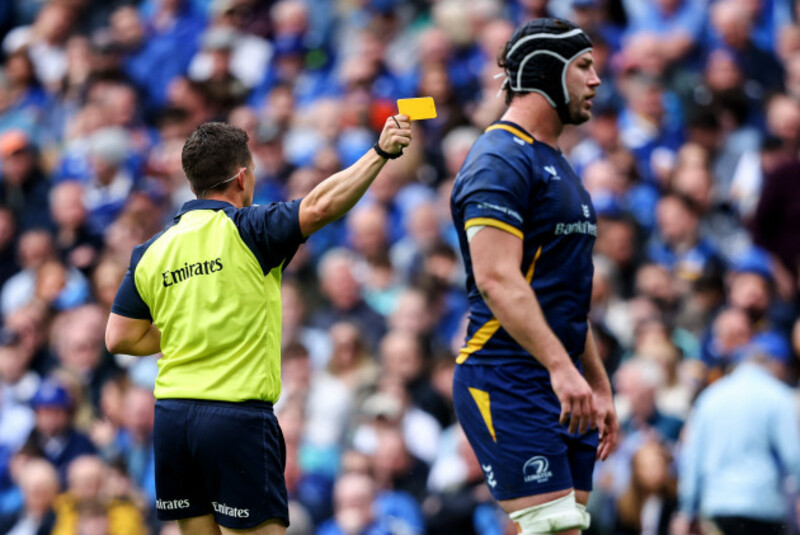 Luke Pearce shows Andrew Porter a yellow card.