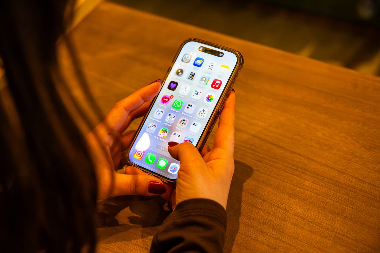 A new UN Women report says online violence against women in the media is growing, becoming increasingly sophisticated, and is affecting female journalists both professionally and personally. In this March 2026 file photo, a person holds a smartphone.