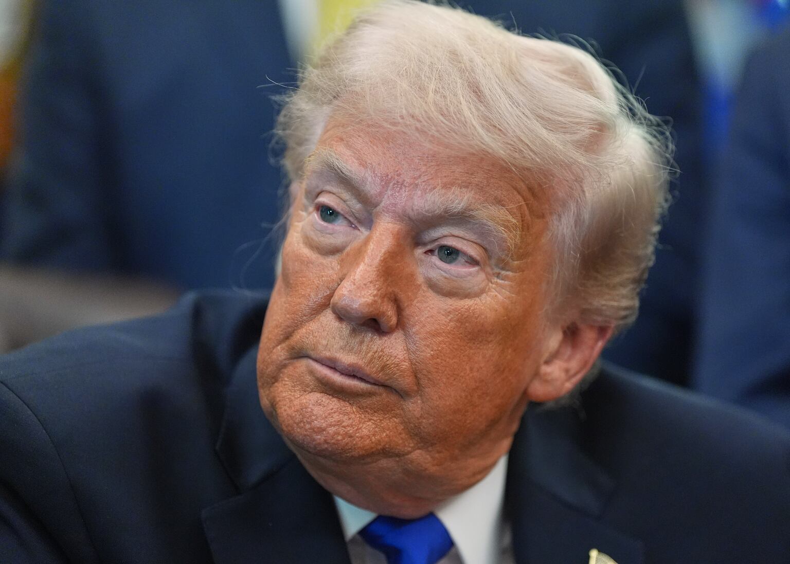 US President Donald Trump speaks to reporters in the Oval Office of the White House (Alex Brandon/AP)