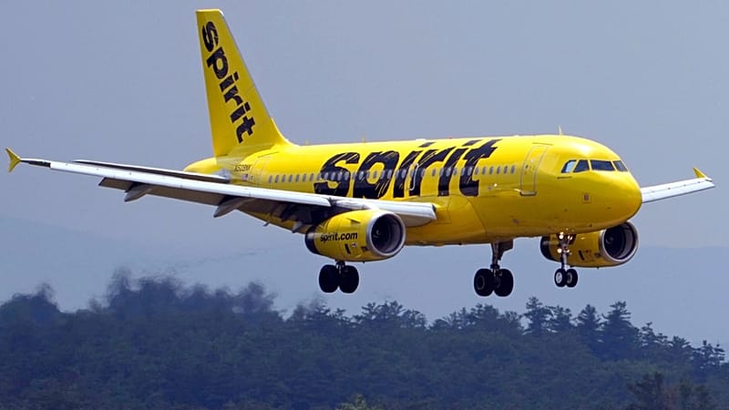 FILE - A Spirit Airlines 319 Airbus approaches Manchester Boston Regional Airport for a landing, June 2, 2023, in Manchester, New Hampshire
