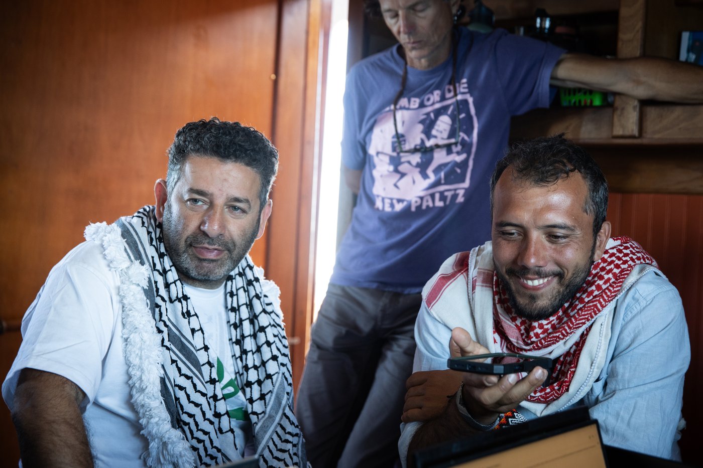 Saif Abukeshek, a Palestinian-Spanish activist and member of the Global Sumud Flotilla's steering committee, left, and Thiago Ávila, a Brazilian activist and member of the Global Sumud Flotilla's steering committee, aboard the Greenpeace vessel Arctic Sunrise, which joined a Gaza-bound flotilla in the Mediterranean Sea on April 18, 2026. (Max Cavallari/Greenpeace via AP)