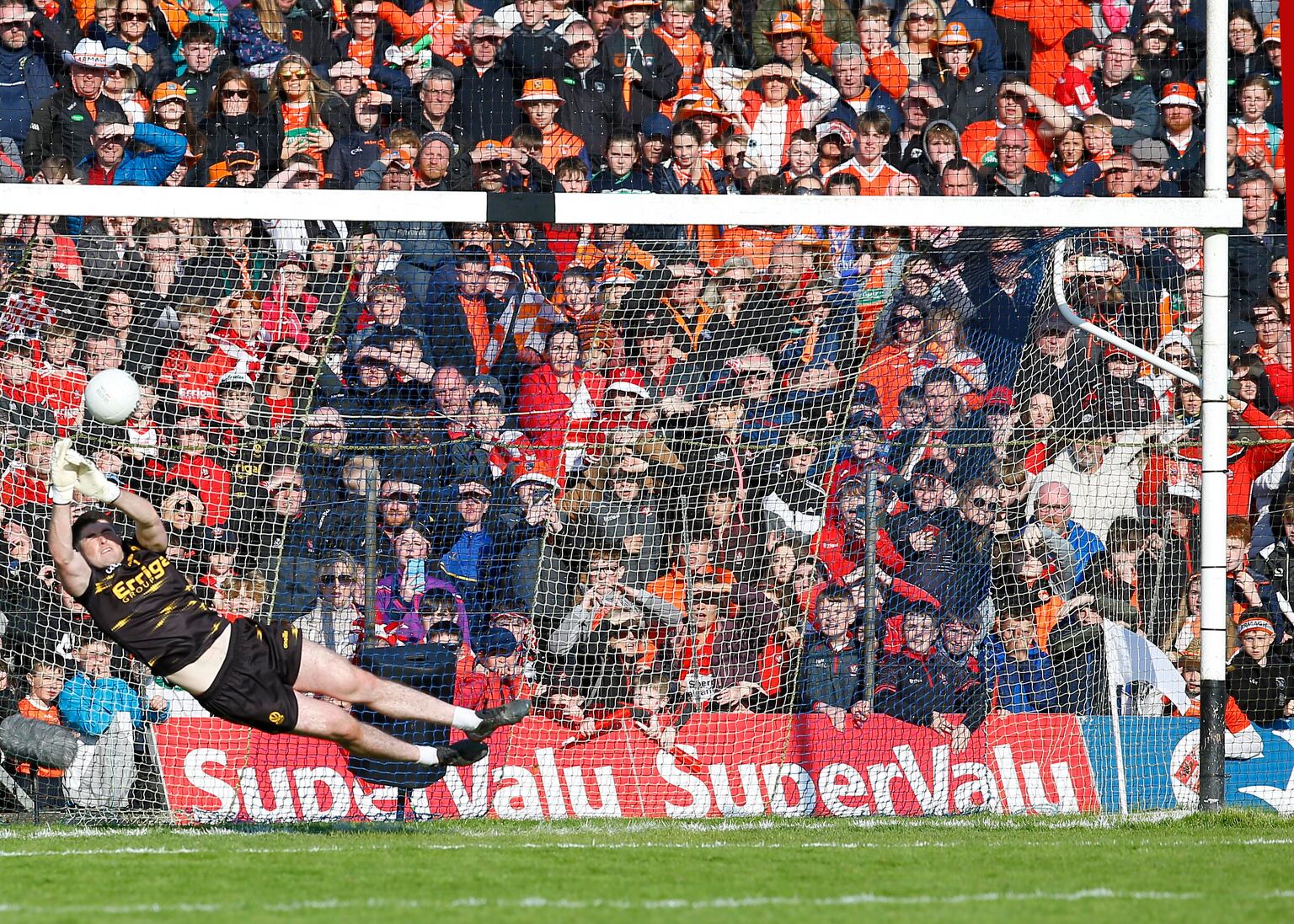 Derry's Odhran Lynch saves an Armagh penalty during the shoot-out in the 2023 Ulster SFC Final at St Tiernach's Park, Clones.
