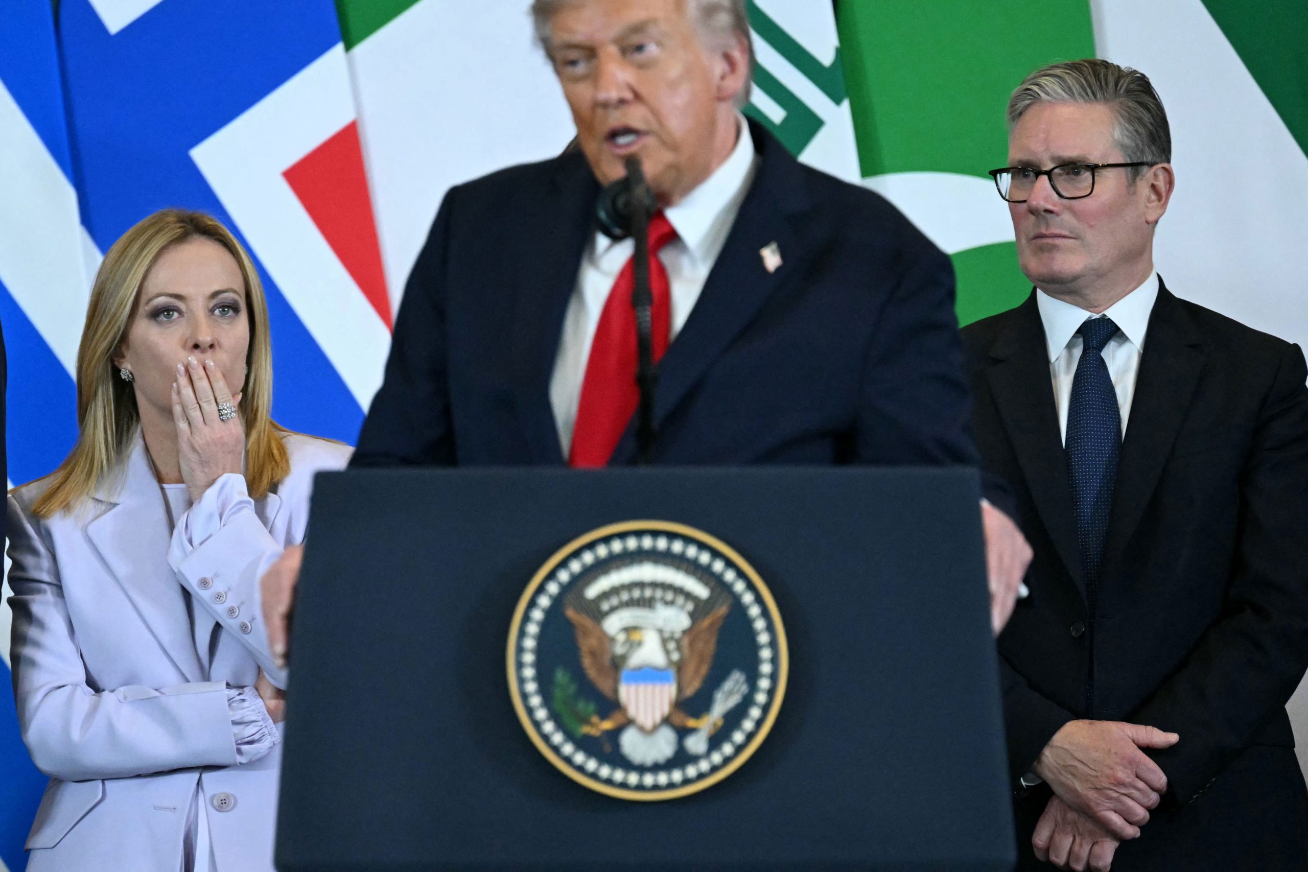 U.S. President Donald Trump speaks as Italian Prime Minister Giorgia Meloni and Britain's Prime Minister Keir Starmer watch on during the Sharm El-Sheikh Peace Summit in the Egypt on Oct. 13, 2025. —Saul Loeb––Getty Images