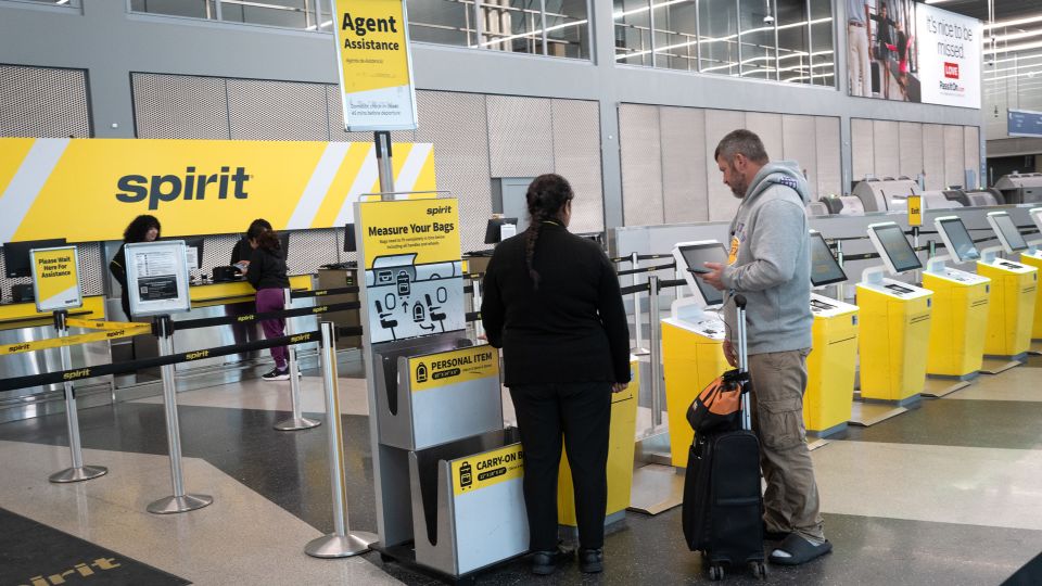 Passengers check in for Spirit Airlines flights in March at Chicago's O'Hare International Airport. - Scott Olson/Getty Images/File