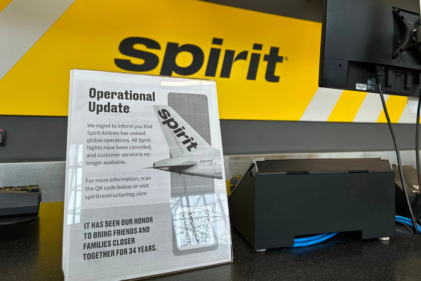 A sign announces Spirit Airlines' shutdown on Saturday, May 2, 2026 at Hartsfield-Jackson Atlanta International Airport in Atlanta. (AP Photo/Jeff Amy)