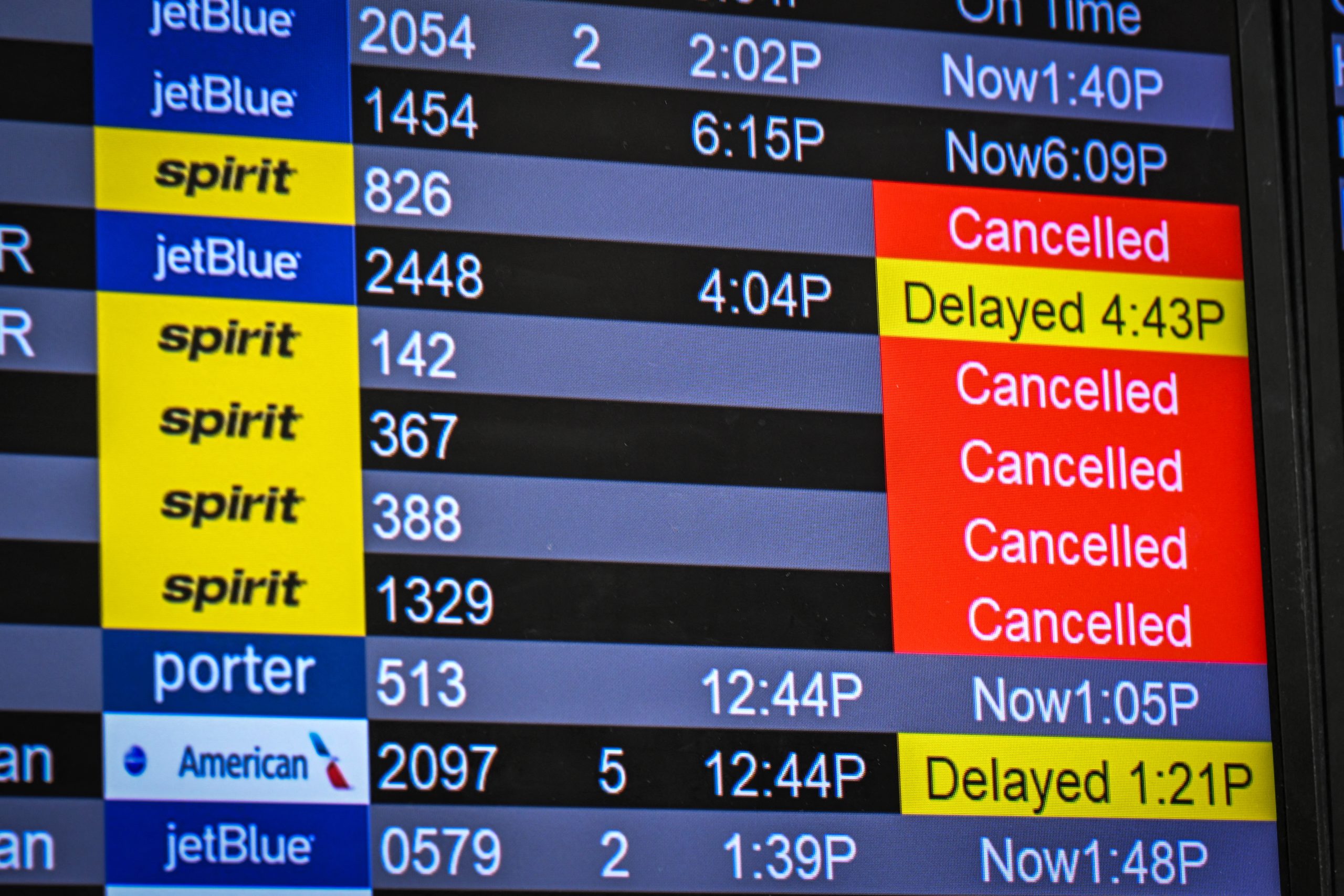 Flights information screens show Spirit Airlines's cancellations at Fort Lauderdale-Hollywood International Airport in Fort Lauderdale, Florida, on May 2, 2026. US air carriers mobilized Saturday to help passengers and crew members stranded by the overnight shutdown of Spirit Airlines, after last-minute talks with creditors and the White House collapsed. The budget airline known for its bright yellow planes succumbed to crushing fuel prices and announced in the early hours of Saturday that "all flights have been canceled, and customer service is no longer available" as it "started winding down its global operations, effective immediately." (Photo by GIORGIO VIERA / AFP via Getty Images)