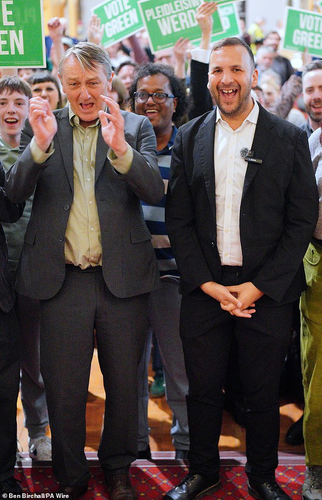 Zack Polanski and Anthony Slaughter (both centre, side by side) were on the campaign trail in Cardiff today