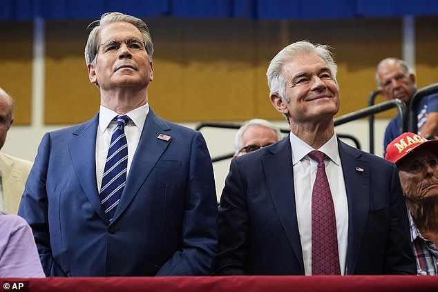 Treasury Secretary Scott Bessent (left) and Centers for Medicare & Medicaid Services administrator Dr. Mehmet Oz (right) listen to President Donald Trump speak at the Villages in Florida on Friday
