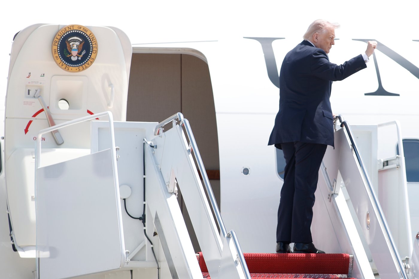 President Donald Trump gestures as he boards Air Force One, Friday, May 1, 2026, at Joint Base Andrews, Md. (AP Photo/Luis M. Alvarez)