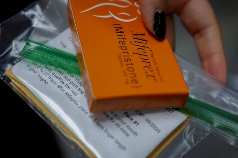 A staff member at Alamo Women's Clinic prepares Mifepristone, the first pill in a medical abortion, for a patient in Carbondale, Illinois, U.S., April 9, 2024. REUTERS/Evelyn Hockstein
