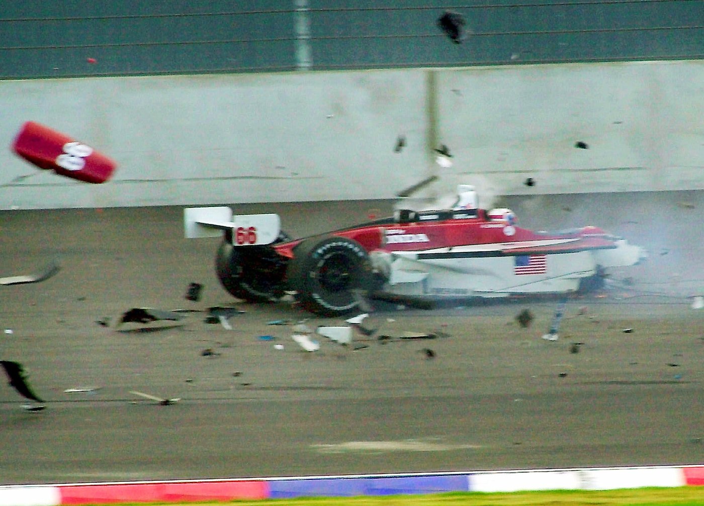FILE - Italian driver Alex Zanardi's car breaks up after it crashed with Canadian driver Alex Tagliani during the CART car race at the Eurospeedway Lausitz in Klettwitz, eastern Germany, Saturday, Sept. 15, 2001. (AP Photo/Eckehard Schulz)