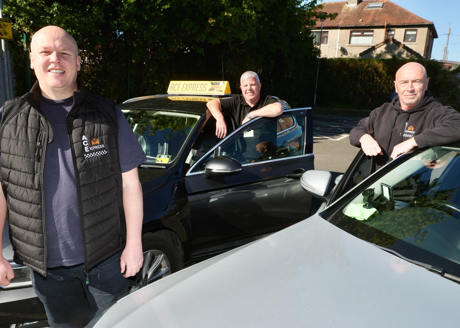 Paul Hesky owner of ACE Express in Andersonstown with drivers Joey Campbell and Mark Devenney. PICTURE: MAL MCCANN
